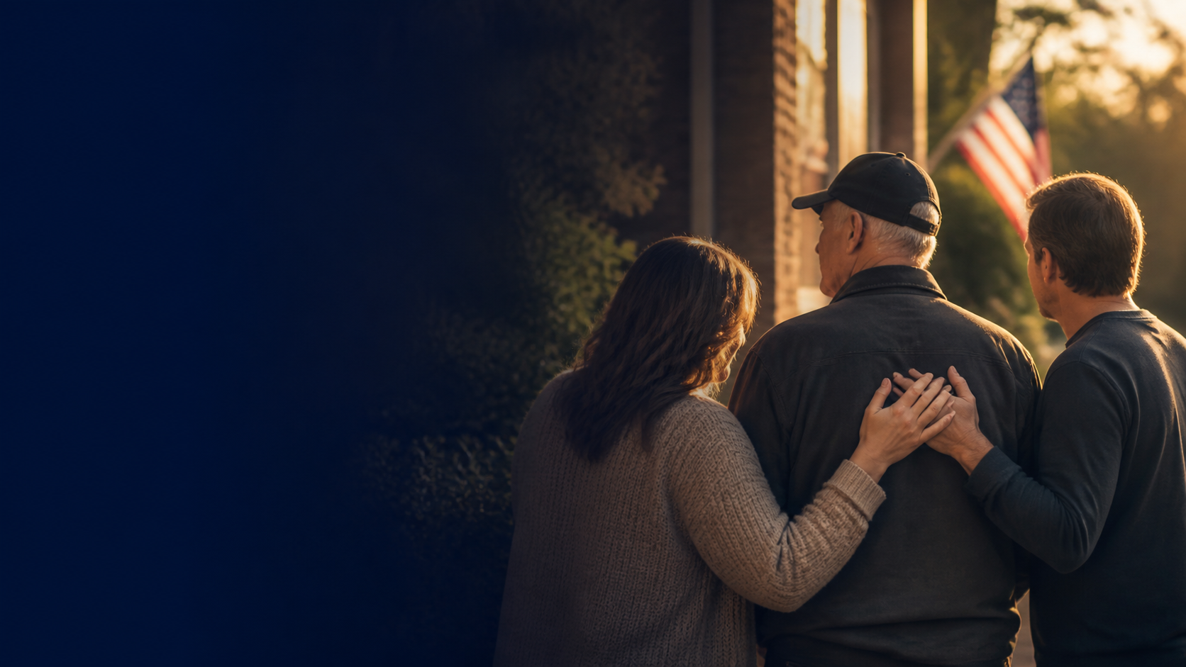 A veteran standing with family and community support in warm evening light.